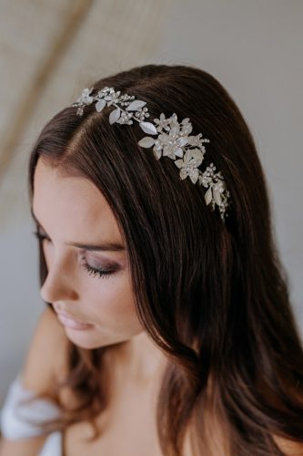Bride wearing gorgeous medium sized silver hair vine.