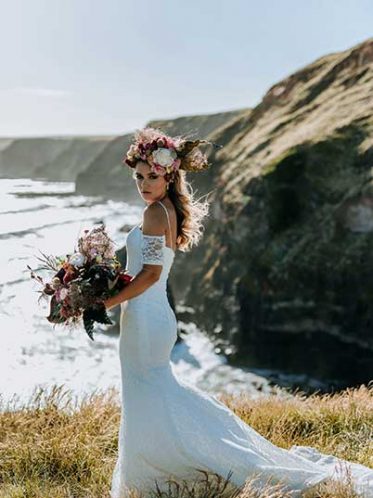 Fitted lace wedding dress at the beach