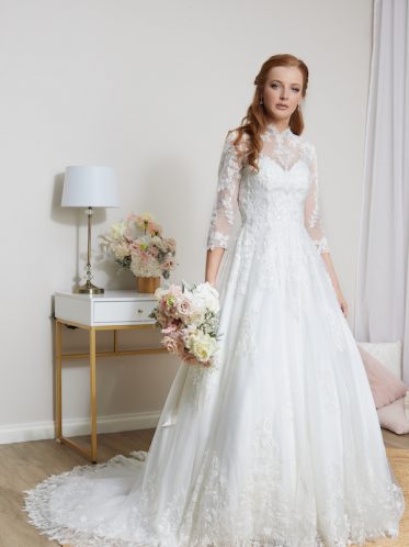 Lace high neck wedding dress with sleeves.