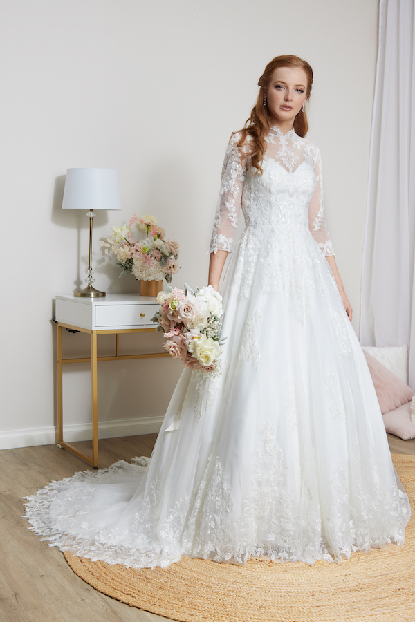 Lace high neck wedding dress with sleeves.