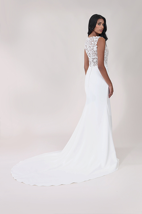 Detailed lace back fitted wedding dress with a train