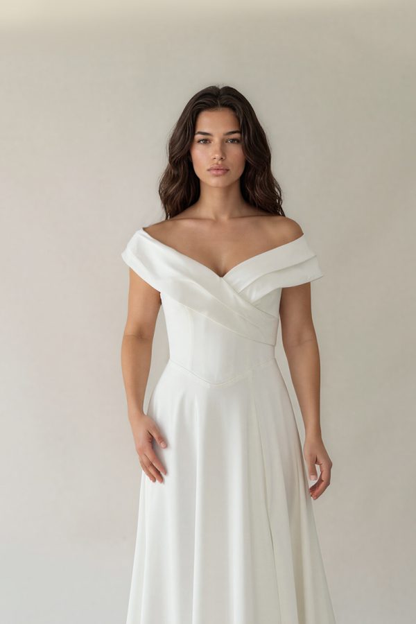 Draped crossover neckline on Naomi off-the-shoulder satin wedding dress