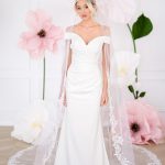 Misha ivory fitted crepe wedding dress with off shoulder neckline