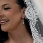 Drop Earrings worn by bride with lace trim veil