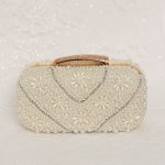 Rose Gold Clutch for bride at wedding.