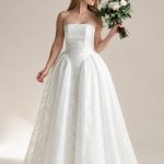 Onyx ivory lace wedding dress with ruched hips