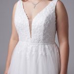 Close-up of the floral lace bodice, wide straps and illusion V-neckline on the plus size deb dress